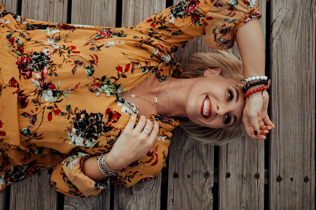 models wearing LWK crystal bracelets in Red Magnesite, White Howlite, Onyx., wrap bracelet 